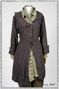 Chevallier Duster Coat in Anchor Grey Wondrous Washed Linen; Chevallier Shirt in Seagrass Petite Check Linen; Chevallier Trousers in Seagrass Herringbone Twill with contrasting lacing to match shirt; Clotaire Sash in Pointillism Silk Chiffon. Ivey Abitz bespoke clothing.