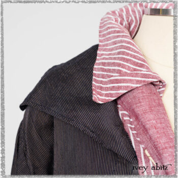 Viv Coat Dress in National Seashore Pinstripe Voile; Clotaire Sash in Red Sky at Night Yarn Dyed Weave; Viv Frock in Red Sky at Night Stripe. Ivey Abitz bespoke clothing.