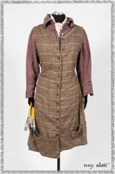Porte Cochere Frock in Earthen and Plum Stretch Plaid; Fairholme Shirt in Plum Tree Washed Linen; Blanchefleur Sash in Ethereal Floral Cotton Voile. Ivey Abitz bespoke clothing.
