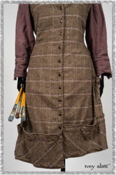 Porte Cochere Frock in Earthen and Plum Stretch Plaid; Fairholme Shirt in Plum Tree Washed Linen; Blanchefleur Sash in Ethereal Floral Cotton Voile. Ivey Abitz bespoke clothing.
