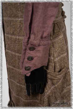 Porte Cochere Frock in Earthen and Plum Stretch Plaid; Fairholme Shirt in Plum Tree Washed Linen; Blanchefleur Sash in Ethereal Floral Cotton Voile. Ivey Abitz bespoke clothing.