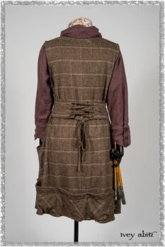 Porte Cochere Frock in Earthen and Plum Stretch Plaid; Fairholme Shirt in Plum Tree Washed Linen; Blanchefleur Sash in Ethereal Floral Cotton Voile. Ivey Abitz bespoke clothing.