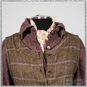 Porte Cochere Frock in Earthen and Plum Stretch Plaid; Fairholme Shirt in Plum Tree Washed Linen; Blanchefleur Sash in Ethereal Floral Cotton Voile. Ivey Abitz bespoke clothing.