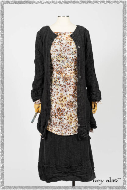 Mewland Jacket in Black Washed Crinkled Linen; Bramley Dress in Plum Tree Watercolour Floral Voile; Mewland Skirt in Black Washed Crinkled Linen; Cilla Slip Frock in Beacon Black Washed Ribbed Knit. Ivey Abitz bespoke clothing.
