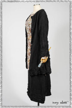 Mewland Jacket in Black Washed Crinkled Linen; Bramley Dress in Plum Tree Watercolour Floral Voile; Mewland Skirt in Black Washed Crinkled Linen; Cilla Slip Frock in Beacon Black Washed Ribbed Knit. Ivey Abitz bespoke clothing.