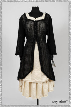 Ardsley Duster Coat in Beacon Black Lace Netted Knit; Ardsleydale Frock in Ethereal Cream Embroidered Crushed Plaid; Clotaire Sash in Ethereal Cream and Black Fleur Stretch Cotton. Ivey Abitz bespoke clothing.