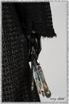 Ardsley Duster Coat in Beacon Black Lace Netted Knit; Ardsleydale Frock in Ethereal Cream Embroidered Crushed Plaid; Clotaire Sash in Ethereal Cream and Black Fleur Stretch Cotton. Ivey Abitz bespoke clothing.
