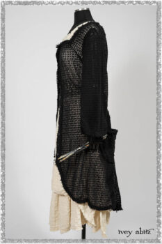 Ardsley Duster Coat in Beacon Black Lace Netted Knit; Ardsleydale Frock in Ethereal Cream Embroidered Crushed Plaid; Clotaire Sash in Ethereal Cream and Black Fleur Stretch Cotton. Ivey Abitz bespoke clothing.
