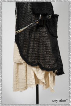 Ardsley Duster Coat in Beacon Black Lace Netted Knit; Ardsleydale Frock in Ethereal Cream Embroidered Crushed Plaid; Clotaire Sash in Ethereal Cream and Black Fleur Stretch Cotton. Ivey Abitz bespoke clothing.