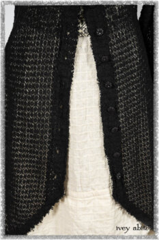Ardsley Duster Coat in Beacon Black Lace Netted Knit; Ardsleydale Frock in Ethereal Cream Embroidered Crushed Plaid; Clotaire Sash in Ethereal Cream and Black Fleur Stretch Cotton. Ivey Abitz bespoke clothing.