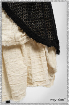 Ardsley Duster Coat in Beacon Black Lace Netted Knit; Ardsleydale Frock in Ethereal Cream Embroidered Crushed Plaid; Clotaire Sash in Ethereal Cream and Black Fleur Stretch Cotton. Ivey Abitz bespoke clothing.