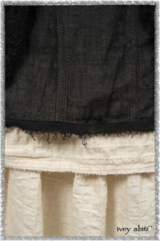 Ardsley Duster Coat in Beacon Black Lace Netted Knit; Clotaire Sash in Ethereal Cream and Black Fleur Stretch Cotton; Ardsley Frock in Beacon Black Hemstitch Stripe Gauze; Ardsleydale Frock in Ethereal Cream Embroidered Crushed Plaid. Ivey Abitz bespoke clothing.
