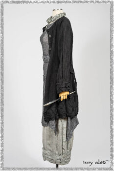 Mewland Jacket in Black Washed Crinkled Linen; Clotaire Sash in Ethereal Cream and Black Fleur Stretch Cotton; Bramley Overlay in Black White Painted Puckery Weave; Mewland Trousers in Beacon Blcak Embroidered Plaid on Petite Stripe. Ivey Abitz bespoke clothing.