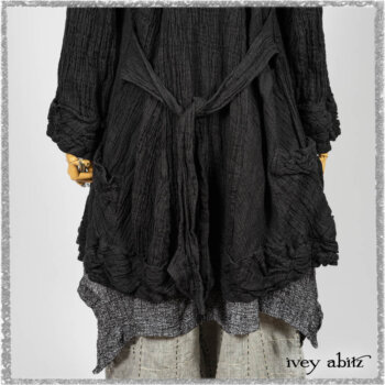 Mewland Jacket in Black Washed Crinkled Linen; Clotaire Sash in Ethereal Cream and Black Fleur Stretch Cotton; Bramley Overlay in Black White Painted Puckery Weave; Mewland Trousers in Beacon Blcak Embroidered Plaid on Petite Stripe. Ivey Abitz bespoke clothing.