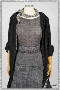 Mewland Jacket in Black Washed Crinkled Linen; Clotaire Sash in Ethereal Cream and Black Fleur Stretch Cotton; Bramley Overlay in Black White Painted Puckery Weave; Mewland Trousers in Beacon Blcak Embroidered Plaid on Petite Stripe. Ivey Abitz bespoke clothing.