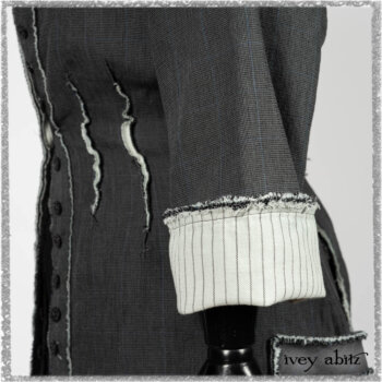 Trelawny Duster Coat in Estuary and Black Houndstooth on Pinstripe; Trelawny Vest in Beacon Black Hemstitch Stripe Gauze; Clotaire Sash in Ethereal Cream and Black Fleur Stretch Cotton; Ardsleydale Frock in Ethereal Cream Embroidered Crushed Plaid. Ivey Abitz bespoke clothing.