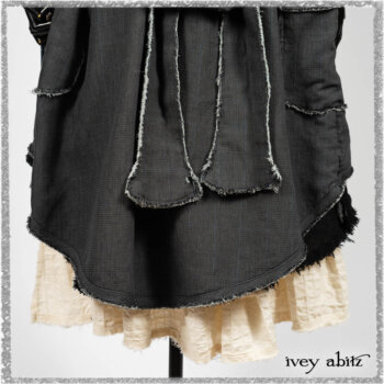 Trelawny Duster Coat in Estuary and Black Houndstooth on Pinstripe; Trelawny Vest in Beacon Black Hemstitch Stripe Gauze; Clotaire Sash in Ethereal Cream and Black Fleur Stretch Cotton; Ardsleydale Frock in Ethereal Cream Embroidered Crushed Plaid. Ivey Abitz bespoke clothing.
