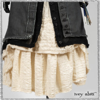 Trelawny Duster Coat in Estuary and Black Houndstooth on Pinstripe; Trelawny Vest in Beacon Black Hemstitch Stripe Gauze; Clotaire Sash in Ethereal Cream and Black Fleur Stretch Cotton; Ardsleydale Frock in Ethereal Cream Embroidered Crushed Plaid. Ivey Abitz bespoke clothing.