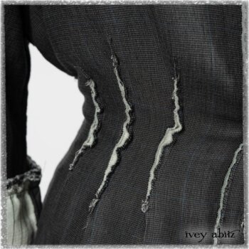 Trelawny Duster Coat in Estuary and Black Houndstooth on Pinstripe; Trelawny Vest in Beacon Black Hemstitch Stripe Gauze; Clotaire Sash in Ethereal Cream and Black Fleur Stretch Cotton; Ardsleydale Frock in Ethereal Cream Embroidered Crushed Plaid. Ivey Abitz bespoke clothing.