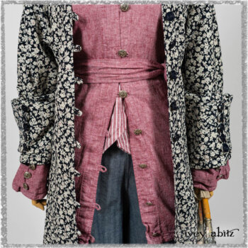 Pierrepont Shirt in Red Sky at Night Yarn Dyed Weave; Viv Coat Dress in National Seashore Floral Jacquard; Clotaire Sash in Red Sky at Night Stripe; Viv Trousers in Estuary Herringbone Twill. Ivey Abitz bespoke clothing.