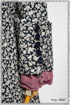 Pierrepont Shirt in Red Sky at Night Yarn Dyed Weave; Viv Coat Dress in National Seashore Floral Jacquard; Clotaire Sash in Red Sky at Night Stripe; Viv Trousers in Estuary Herringbone Twill. Ivey Abitz bespoke clothing.