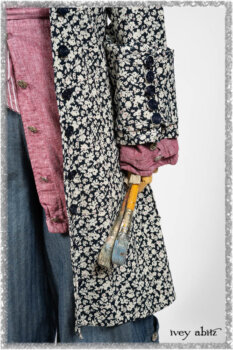 Pierrepont Shirt in Red Sky at Night Yarn Dyed Weave; Viv Coat Dress in National Seashore Floral Jacquard; Clotaire Sash in Red Sky at Night Stripe; Viv Trousers in Estuary Herringbone Twill. Ivey Abitz bespoke clothing.