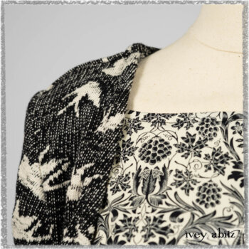 Elliot Jacket in Beacon Black Flora and Fauna Knit; Tollie Dress in Estuary Cream and Black Fleur Stretch Cotton; Clotaire Sash in Ethereal Cream and Black Fleur Stretch Cotton; Mewland Skirt in Black Washed Crinkled Linen. Ivey Abitz bespoke clothing.