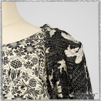 Elliot Jacket in Beacon Black Flora and Fauna Knit; Tollie Dress in Estuary Cream and Black Fleur Stretch Cotton; Clotaire Sash in Ethereal Cream and Black Fleur Stretch Cotton; Mewland Skirt in Black Washed Crinkled Linen. Ivey Abitz bespoke clothing.