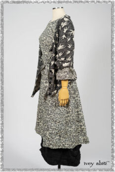Elliot Jacket in Beacon Black Flora and Fauna Knit; Tollie Dress in Estuary Cream and Black Fleur Stretch Cotton; Clotaire Sash in Ethereal Cream and Black Fleur Stretch Cotton; Mewland Skirt in Black Washed Crinkled Linen. Ivey Abitz bespoke clothing.