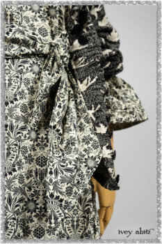Elliot Jacket in Beacon Black Flora and Fauna Knit; Tollie Dress in Estuary Cream and Black Fleur Stretch Cotton; Clotaire Sash in Ethereal Cream and Black Fleur Stretch Cotton; Mewland Skirt in Black Washed Crinkled Linen. Ivey Abitz bespoke clothing.