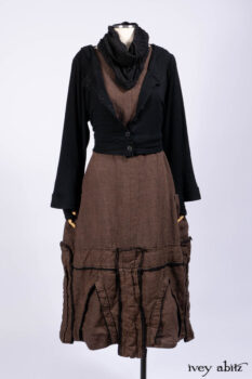 Hudson Jacket in Signature Black Ribbed Knit; Roebling Frock in Brownstone Washed Linen; Lydia Neck Wrap and Lydia Arm Wraps in Signature Black Washed Knit; Cilla Slip Frock in Signature Black Ribbed Knit.