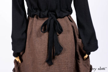 Hudson Jacket in Signature Black Ribbed Knit; Roebling Frock in Brownstone Washed Linen; Lydia Neck Wrap and Lydia Arm Wraps in Signature Black Washed Knit; Cilla Slip Frock in Signature Black Ribbed Knit.