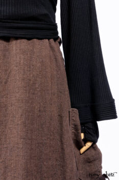 Hudson Jacket in Signature Black Ribbed Knit; Roebling Frock in Brownstone Washed Linen; Lydia Neck Wrap and Lydia Arm Wraps in Signature Black Washed Knit; Cilla Slip Frock in Signature Black Ribbed Knit.