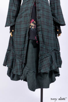 Inglenook Duster Coat in Riverside Black Watch Double Layered Weave; Nook Frock in Riverside Floral Silk Chiffon; Inglenook Frock in Riverside Plaid Cotton; Lydia Neck Wrap and Lydia Arm Wraps in Signature Black Washed Knit.