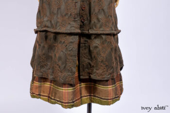 Harrison Duster Coat in Brownstone Crewel Work Weave; Harrison Frock in Cenral Park Brownstone Plaid Silk; Cilla Slip Frock in Signature Black Washed Knit.