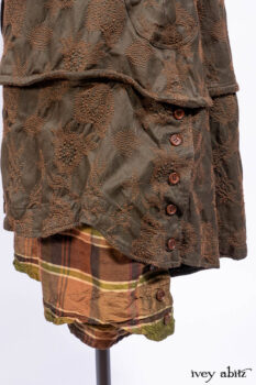 Harrison Duster Coat in Brownstone Crewel Work Weave; Harrison Frock in Cenral Park Brownstone Plaid Silk; Cilla Slip Frock in Signature Black Washed Knit.