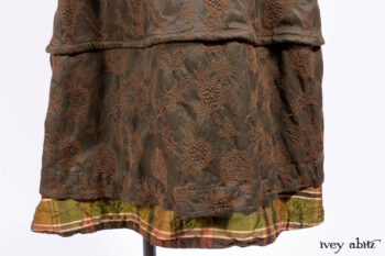 Harrison Duster Coat in Brownstone Crewel Work Weave; Harrison Frock in Cenral Park Brownstone Plaid Silk; Cilla Slip Frock in Signature Black Washed Knit.