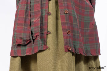 Pierrepont Shirt in Brooklyn Washed Plaid Silk; Limited Edition Clotaire Sash in Central Park Plaid Silk; Cape Frock in Central Park Washed Linen; Cilla Slip Frock in Signature Black Ribbed Knit.