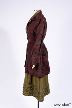 Pierrepont Shirt in Brooklyn Washed Plaid Silk; Limited Edition Clotaire Sash in Central Park Plaid Silk; Cape Frock in Central Park Washed Linen; Cilla Slip Frock in Signature Black Ribbed Knit.