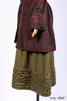 Pierrepont Shirt in Brooklyn Washed Plaid Silk; Limited Edition Clotaire Sash in Central Park Plaid Silk; Cape Frock in Central Park Washed Linen; Cilla Slip Frock in Signature Black Ribbed Knit.