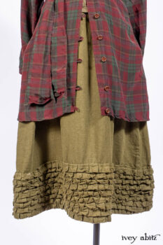 Pierrepont Shirt in Brooklyn Washed Plaid Silk; Limited Edition Clotaire Sash in Central Park Plaid Silk; Cape Frock in Central Park Washed Linen; Cilla Slip Frock in Signature Black Ribbed Knit.
