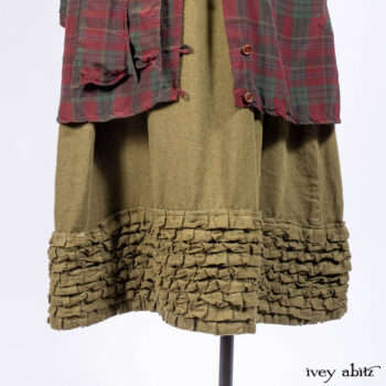 Pierrepont Shirt in Brooklyn Washed Plaid Silk; Limited Edition Clotaire Sash in Central Park Plaid Silk; Cape Frock in Central Park Washed Linen; Cilla Slip Frock in Signature Black Ribbed Knit.
