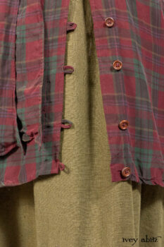 Pierrepont Shirt in Brooklyn Washed Plaid Silk; Limited Edition Clotaire Sash in Central Park Plaid Silk; Cape Frock in Central Park Washed Linen; Cilla Slip Frock in Signature Black Ribbed Knit.