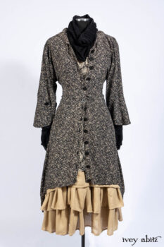 Baudelaire Duster Coat in Mansard Roof and Sandstone Washed Crepe; Delphine Dress in Mansard Roof and Sandstone Sprig Silk Chiffon; Lydia Neck Wrap and Lydia Arm Sleeves in Signature Black Washed Knit; Everett Frock in Sandstone Washed Weave.