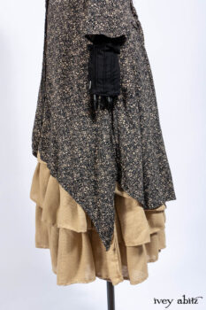Baudelaire Duster Coat in Mansard Roof and Sandstone Washed Crepe; Delphine Dress in Mansard Roof and Sandstone Sprig Silk Chiffon; Lydia Neck Wrap and Lydia Arm Sleeves in Signature Black Washed Knit; Everett Frock in Sandstone Washed Weave.