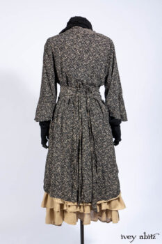 Baudelaire Duster Coat in Mansard Roof and Sandstone Washed Crepe; Delphine Dress in Mansard Roof and Sandstone Sprig Silk Chiffon; Lydia Neck Wrap and Lydia Arm Sleeves in Signature Black Washed Knit; Everett Frock in Sandstone Washed Weave.
