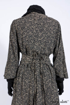 Baudelaire Duster Coat in Mansard Roof and Sandstone Washed Crepe; Delphine Dress in Mansard Roof and Sandstone Sprig Silk Chiffon; Lydia Neck Wrap and Lydia Arm Sleeves in Signature Black Washed Knit; Everett Frock in Sandstone Washed Weave.