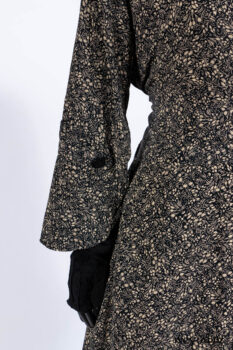 Baudelaire Duster Coat in Mansard Roof and Sandstone Washed Crepe; Delphine Dress in Mansard Roof and Sandstone Sprig Silk Chiffon; Lydia Neck Wrap and Lydia Arm Sleeves in Signature Black Washed Knit; Everett Frock in Sandstone Washed Weave.