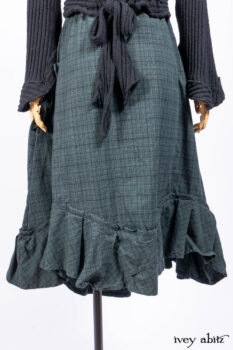 Nook Jacket in Mansard Roof Stripe Boucl&eacute; Knit; Clotaire Sash in Riverside Floral Silk Chiffon; Inglenook Frock in Riverside Plaid Cotton; Cilla Slip Frock in Signature Black Ribbed Knit.