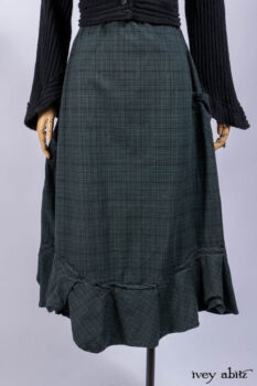 Nook Jacket in Mansard Roof Stripe Boucl&eacute; Knit; Clotaire Sash in Riverside Floral Silk Chiffon; Inglenook Frock in Riverside Plaid Cotton; Cilla Slip Frock in Signature Black Ribbed Knit.